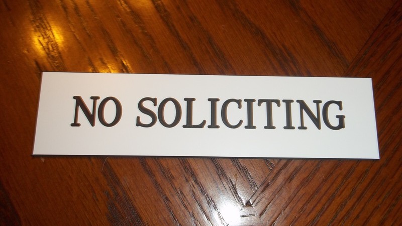 Acrylic Engraved No Soliciting Sign White W/Black Letters W/Double stick tape.