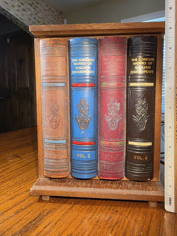 Vintage Faux Shakespeare book hidden liquor cabinet with compartments.