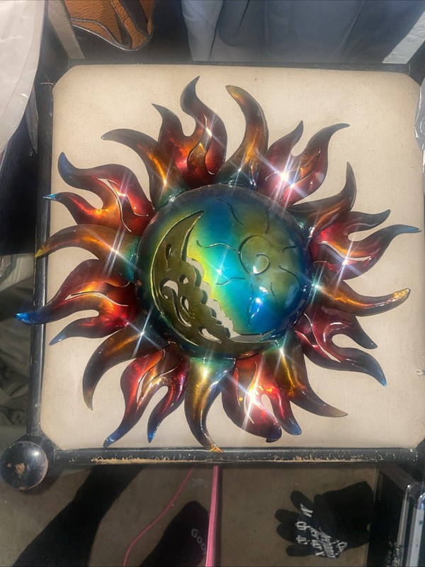 Metal sun and moon whimsical