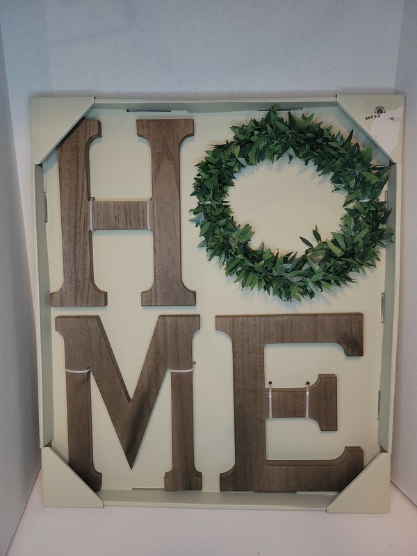 “Home” wall decor. Word “Home” with wreath as “O”, other letters are wood-like