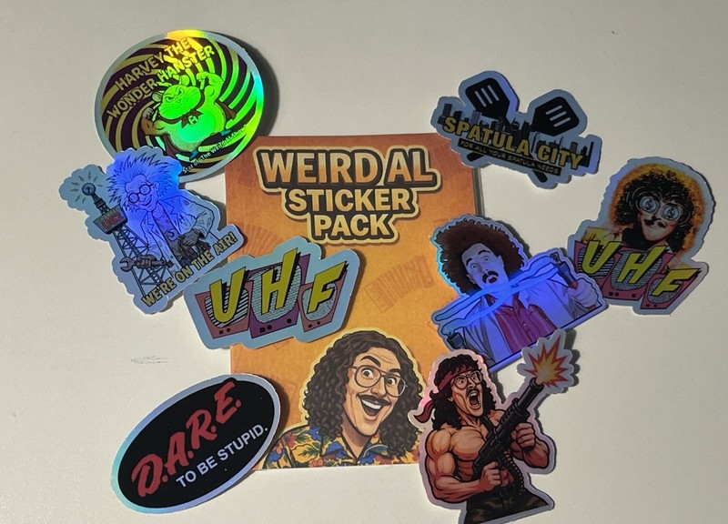 WEIRD AL STICKER MYSTERY PACK – EXPECT THE UNEXPECTED (8 HOLOGRAPHIC STICKERS)