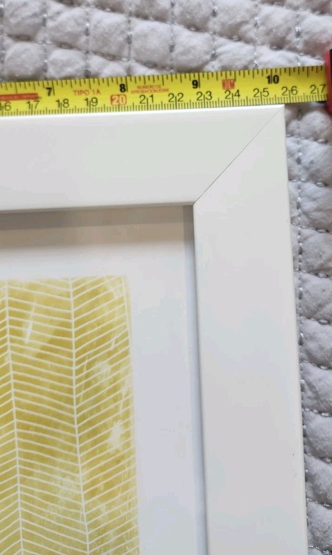 Yellow and White Geometric Print Wall Art Housed in a White Hard Plastic Frame gallery