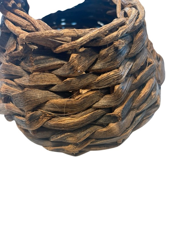 Rustic Hand Woven Basket Made From Natural Materials In An Oval Shape gallery