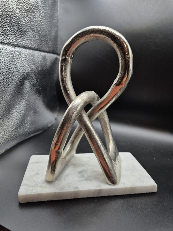 Aged Silver Entwined Sculpture With White Base 8 3/4 Tall