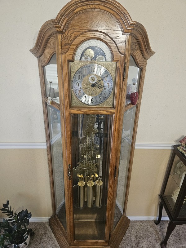 Howard Miller Grandfater Clock And Curio Cabinet.