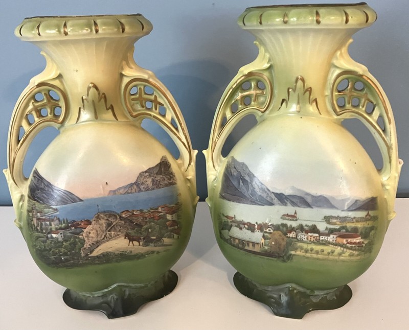 Pair of green landscape vases of unknown origin.