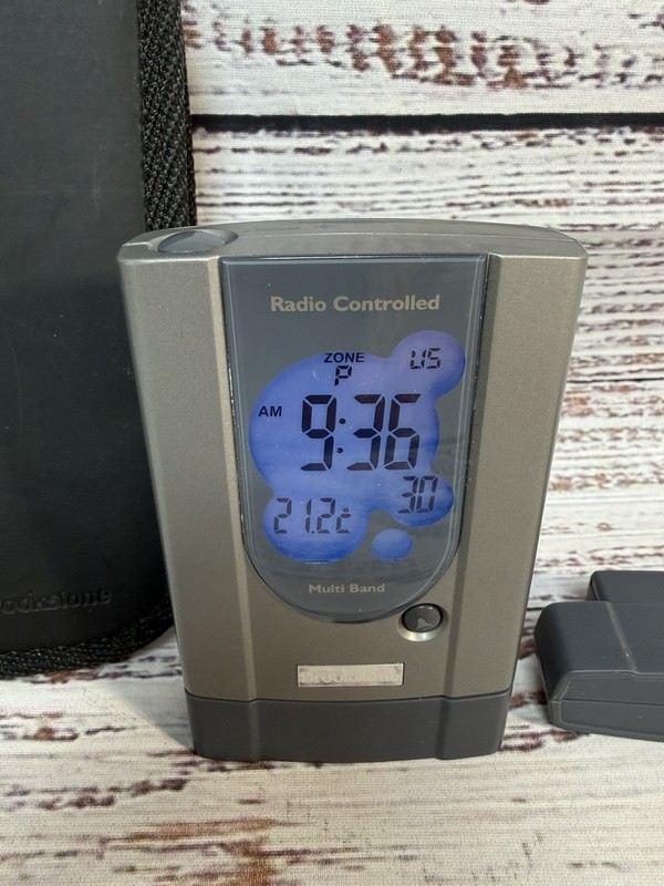 Brookstone Radio Controlled World Travel Alarm Clock w/Case & Cartridges gallery