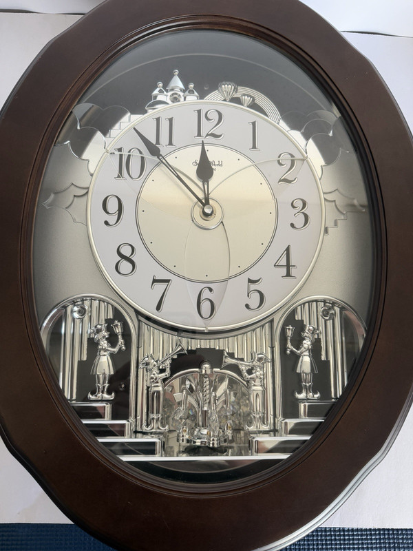 Small World Oval Musical Wall Clock Ave Maria Chime Analog Quartz Brown/Silver