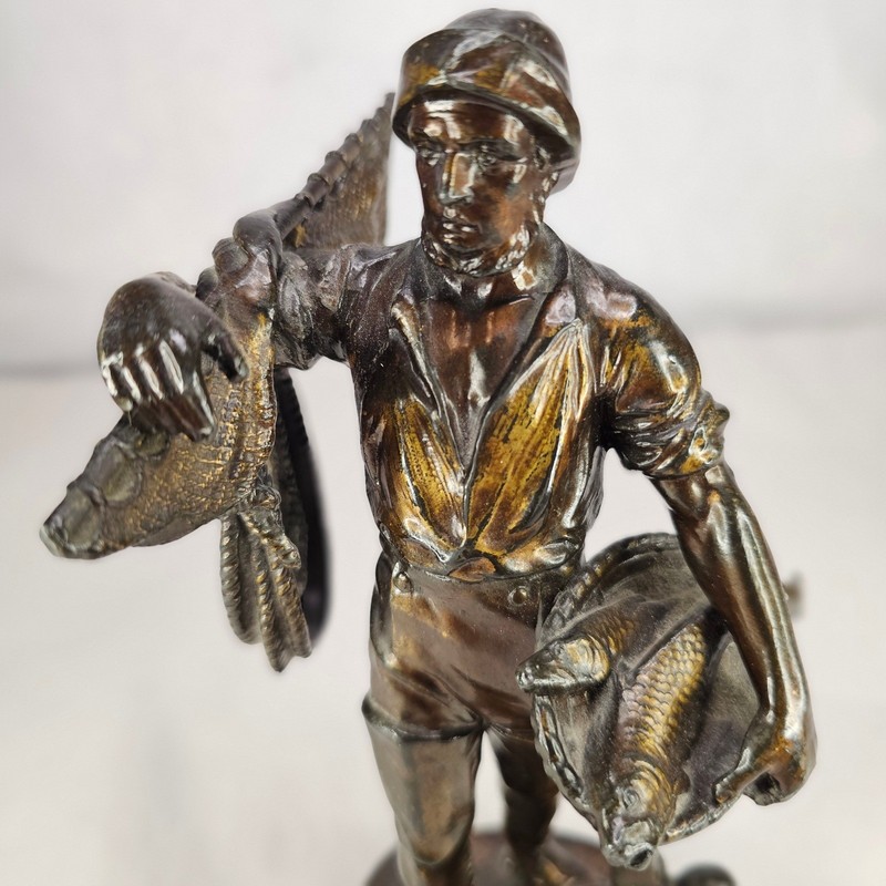 Vintage Bronze Fisherman Statue with Fish and Duck on Anchor Base gallery