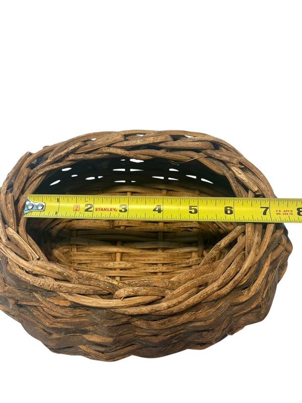 Rustic Hand Woven Basket Made From Natural Materials In An Oval Shape gallery