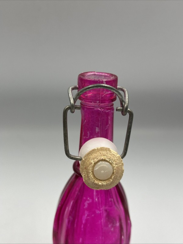 Set Of 2 Colored Glass Bottles With Ceramic Stoppers. 5 " Tall. Pink And Blue gallery